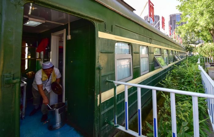 Train Hotel and Train Restaurant, full of strong ancients (old green train compartment)