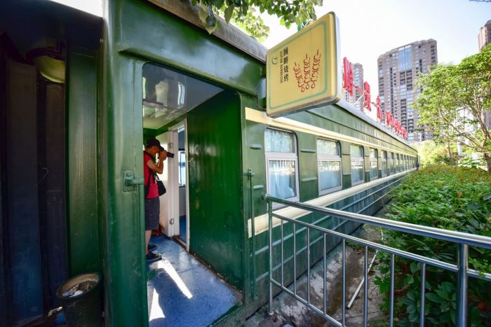 Train Hotel and Train Restaurant, full of strong ancients (old green train compartment)